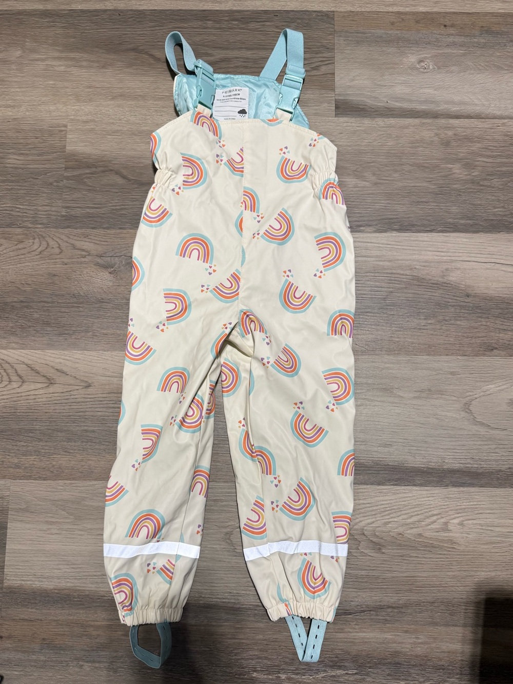 Primark Cream Rainbow Print Waterproof Dungarees with Light Blue Straps